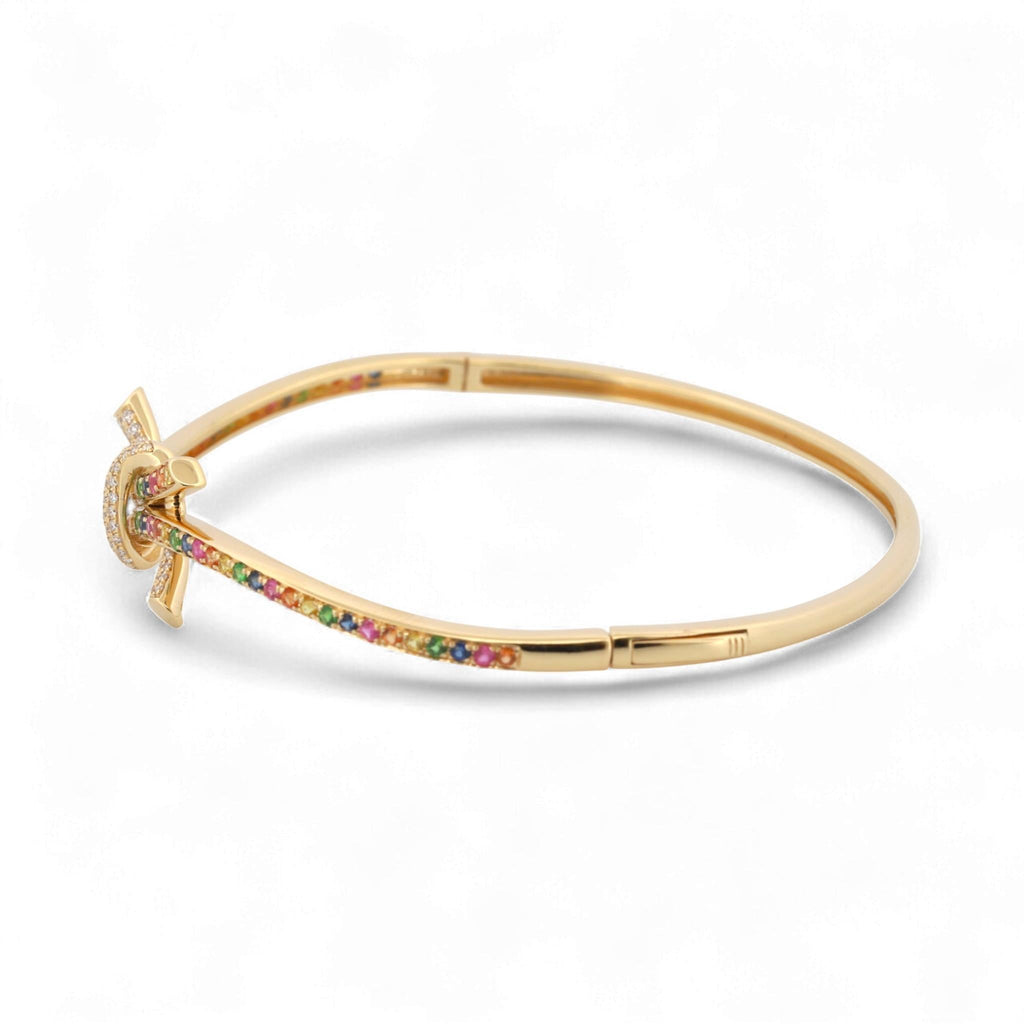 31 Jewels Inc. Effy 14K yellow gold bangle featuring a ribbon twist design with multi-color sapphires and pavé diamonds.