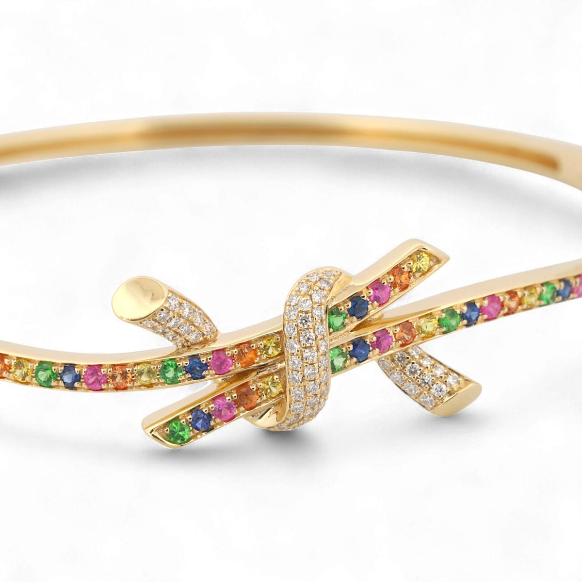 31 Jewels Inc. Effy 14K yellow gold ribbon twist bangle featuring multi-color sapphires and pavé-set diamonds