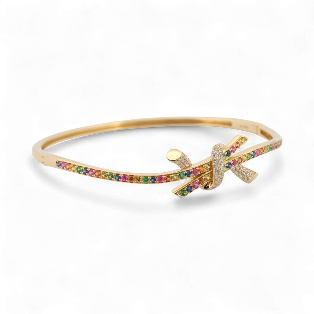 31 Jewels Inc. Effy 14K yellow gold ribbon twist bangle featuring pavé-set multi-color sapphires and diamond accents.