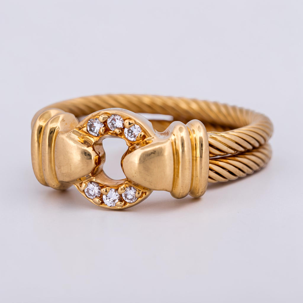 31 Jewels Inc. Philippe Charriol cable ring in 18k yellow gold with a diamond-accented centerpiece.
